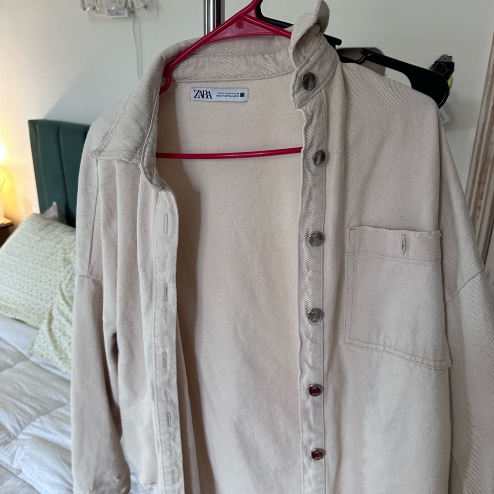 Beige Zara ripped denim jacket
